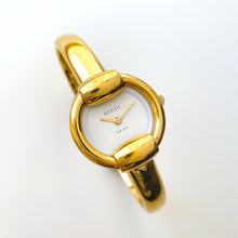 Load image into Gallery viewer, 90s Gold-Plated Gucci 1400L Bangle Quartz Watch with Horsebit Design
