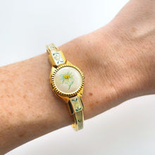 Load image into Gallery viewer, Vintage 1999 Andr√© Mouche Quartz Watch with Enamel Floral Design, Concealed Dial and Gold-Plated Bangle Bracelet
