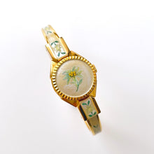 Load image into Gallery viewer, Vintage 1999 Andr√© Mouche Quartz Watch with Enamel Floral Design, Concealed Dial and Gold-Plated Bangle Bracelet
