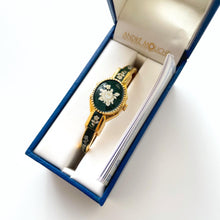 Load image into Gallery viewer, Vintage Andr√© Mouche Quartz Watch with Dark Green Enamel Floral Design, Concealed Dial and Gold-Plated Bangle Bracelet
