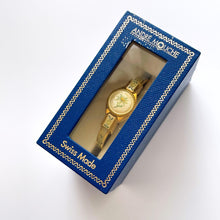 Load image into Gallery viewer, Vintage 1999 Andr√© Mouche Quartz Watch with Enamel Floral Design, Concealed Dial and Gold-Plated Bangle Bracelet
