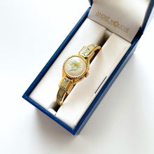 Load image into Gallery viewer, Vintage 1999 Andr√© Mouche Quartz Watch with Enamel Floral Design, Concealed Dial and Gold-Plated Bangle Bracelet
