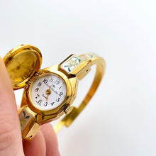 Load image into Gallery viewer, Vintage 1999 Andr√© Mouche Quartz Watch with Enamel Floral Design, Concealed Dial and Gold-Plated Bangle Bracelet
