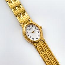 Load image into Gallery viewer, Vintage 1990s Gold-Plated Ladies&#39; Seiko Quartz Watch with White Oval Dial and Roman Numerals
