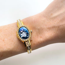 Load image into Gallery viewer, Vintage Andr√© Mouche Quartz Watch with Blue Enamel Floral Design, Concealed Dial and Gold-Plated Crystal-Set Bangle Bracelet
