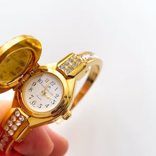 Load image into Gallery viewer, Vintage Andr√© Mouche Quartz Watch with Blue Enamel Floral Design, Concealed Dial and Gold-Plated Crystal-Set Bangle Bracelet
