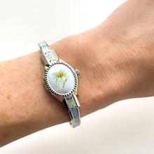 Load image into Gallery viewer, Vintage 1990s Andr√© Mouche Quartz Watch with Light Blue Enamel Floral Design, Concealed Dial and Silver-Tone Bangle Bracelet
