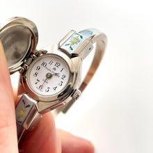 Load image into Gallery viewer, Vintage 1990s Andr√© Mouche Quartz Watch with Light Blue Enamel Floral Design, Concealed Dial and Silver-Tone Bangle Bracelet
