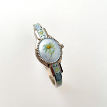 Load image into Gallery viewer, Vintage 1990s Andr√© Mouche Quartz Watch with Light Blue Enamel Floral Design, Concealed Dial and Silver-Tone Bangle Bracelet

