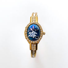 Load image into Gallery viewer, Vintage Andr√© Mouche Quartz Watch with Blue Enamel Floral Design, Concealed Dial and Gold-Plated Crystal-Set Bangle Bracelet
