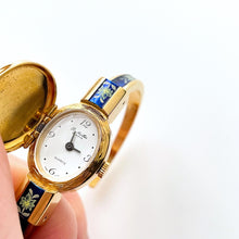 Load image into Gallery viewer, Vintage R. M√ºller Quartz Watch with Blue Enamel Floral Design, Concealed Dial and Gold-Plated Bangle Bracelet

