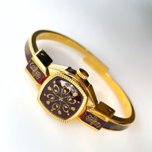 Load image into Gallery viewer, Vintage Andr√© Mouche Quartz Watch with Burgundy Enamel Floral Design, Concealead Dial and Gold-Plated Bangle Bracelet
