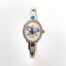 Load image into Gallery viewer, Vintage Andr√© Mouche Quartz Watch with Blue Enamel Floral Design, Concealed Dial and Silver-Tone Bangle Bracelet
