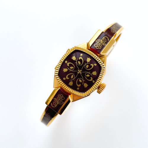 Vintage Andr√© Mouche Quartz Watch with Burgundy Enamel Floral Design, Concealead Dial and Gold-Plated Bangle Bracelet