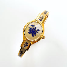 Load image into Gallery viewer, Vintage 00s Andr√© Mouche Quartz Watch with Beige and Blue Enamel Floral Design, Concealed Dial and Gold-Plated Bangle Bracelet - Boxed
