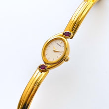 Load image into Gallery viewer, Very Rare 1990s Gold-Plated Seiko Articulated Bangle Quartz Watch with White Dial and Two Rubies
