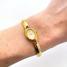 Load image into Gallery viewer, Very Rare 1990s Gold-Plated Seiko Articulated Bangle Quartz Watch with White Dial and Two Rubies

