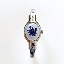 Load image into Gallery viewer, Vintage 1990s André Mouche Quartz Watch with Blue Enamel Floral Design, Concealed Dial and Silver-Tone Bangle Bracelet - Boxed
