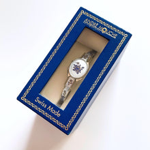 Load image into Gallery viewer, Vintage 1990s André Mouche Quartz Watch with Blue Enamel Floral Design, Concealed Dial and Silver-Tone Bangle Bracelet - Boxed
