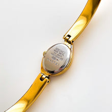 Load image into Gallery viewer, Very Rare 1990s Gold-Plated Seiko Articulated Bangle Quartz Watch with White Dial and Two Rubies
