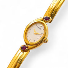Load image into Gallery viewer, Very Rare 1990s Gold-Plated Seiko Articulated Bangle Quartz Watch with White Dial and Two Rubies
