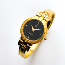 Load image into Gallery viewer, Vintage 1990s Gold-Plated Ladies&#39; Givenchy &#39;Millesime&#39; Bangle Watch with Black Dial and Quartz Movement
