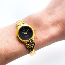 Load image into Gallery viewer, Vintage 1990s Gold-Plated Ladies&#39; Givenchy &#39;Millesime&#39; Bangle Watch with Black Dial and Quartz Movement

