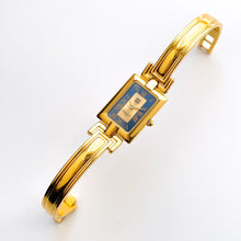 Load image into Gallery viewer, Vintage 1990s Gold-Plated Ladies&#39; Givenchy &#39;Millesime&#39; Bangle Quartz Watch with Black Rectangular Dial
