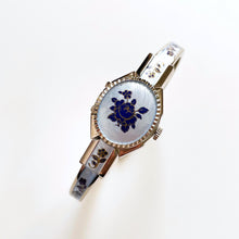 Load image into Gallery viewer, Vintage 1990s André Mouche Quartz Watch with Blue Enamel Floral Design, Concealed Dial and Silver-Tone Bangle Bracelet - Boxed
