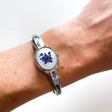 Load image into Gallery viewer, Vintage 1990s André Mouche Quartz Watch with Blue Enamel Floral Design, Concealed Dial and Silver-Tone Bangle Bracelet - Boxed
