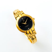 Load image into Gallery viewer, Vintage 1990s Gold-Plated Ladies&#39; Givenchy &#39;Millesime&#39; Bangle Watch with Black Dial and Quartz Movement
