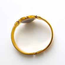 Load image into Gallery viewer, Vintage 1990s Gold-Plated Ladies&#39; Givenchy &#39;Millesime&#39; Bangle Watch with Black Dial and Quartz Movement
