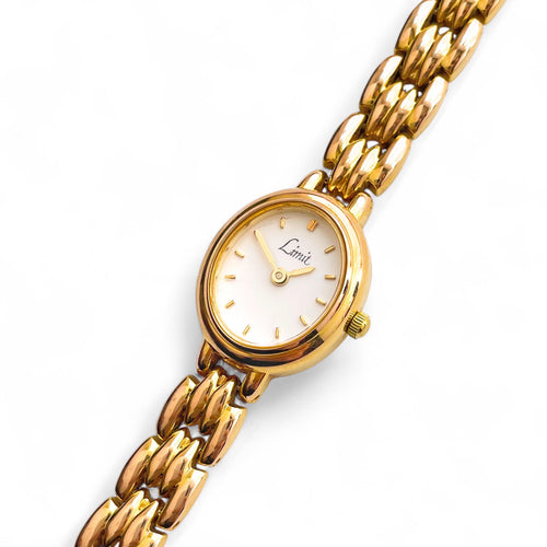 Gold-Tone Ladies' Limit Quartz Watch with Oval Dial and Intricate Bracelet