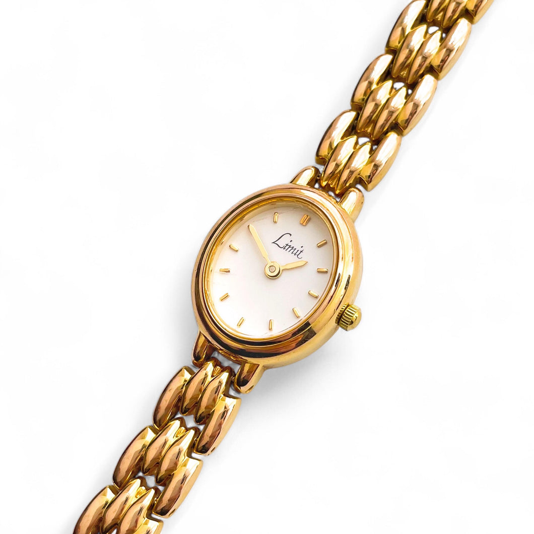 Gold-Tone Ladies' Limit Quartz Watch with Oval Dial and Intricate Bracelet
