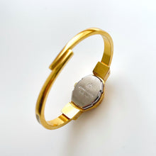 Load image into Gallery viewer, Vintage André Mouche Quartz Watch with Beige and Blue Enamel Floral Design, Concealead Dial and Gold-Plated Bangle Bracelet
