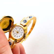 Load image into Gallery viewer, Vintage André Mouche Quartz Watch with Beige and Blue Enamel Floral Design, Concealead Dial and Gold-Plated Bangle Bracelet
