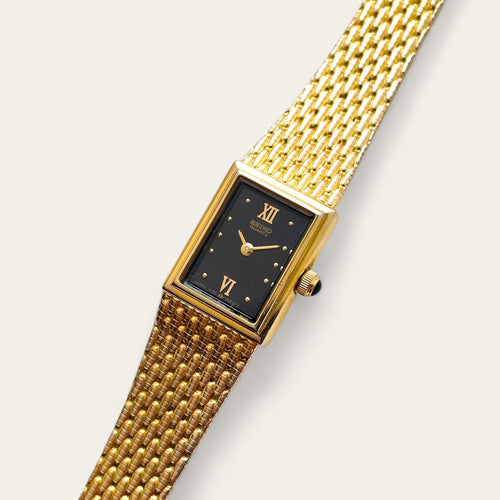 1990s Ladies' Gold-Plated Seiko Quartz Watch with Black Rectangular Dial