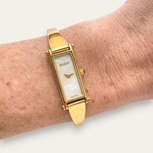 Load image into Gallery viewer, Vintage 1990s Ladies' Gold-Plated Gucci 1500L Bangle Quartz Watch - Mother of Pearl Dial
