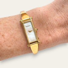 Load image into Gallery viewer, Vintage 1990s Ladies' Gold-Plated Gucci 1500L Bangle Quartz Watch - Mother of Pearl Dial
