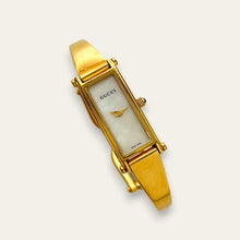 Load image into Gallery viewer, Vintage Gucci 1500L Gold Bangle Watch with Mother of Pearl Dial, 90s Quartz
