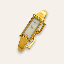 Load image into Gallery viewer, Vintage Gucci 1500L Gold Bangle Watch with Mother of Pearl Dial, 90s Quartz
