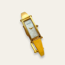 Load image into Gallery viewer, Vintage Gucci 1500L Gold Bangle Watch with Mother of Pearl Dial, 90s Quartz
