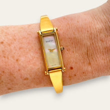 Load image into Gallery viewer, Vintage Gucci 1500L Gold Bangle Watch with Mother of Pearl Dial, 90s Quartz
