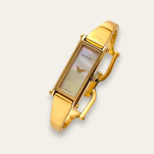Load image into Gallery viewer, Vintage Gucci 1500L Gold Bangle Watch with Mother of Pearl Dial, 90s Quartz
