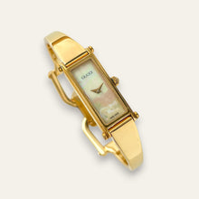 Load image into Gallery viewer, Vintage Gucci 1500 Gold Bangle Watch with Mother of Pearl Dial, 90s Quartz
