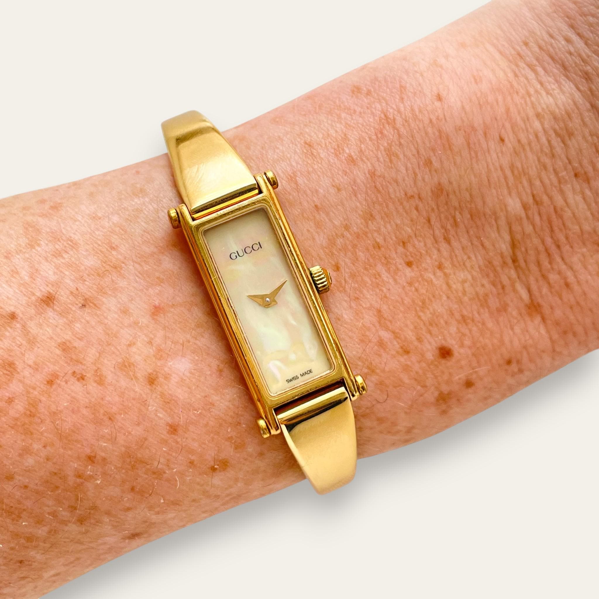 Vintage Gucci 1500 Gold Bangle Watch with Mother of Pearl Dial