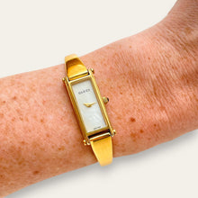 Load image into Gallery viewer, Vintage Gucci 1500L Gold Bangle Watch with Mother of Pearl Dial, 90s Quartz
