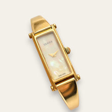 Load image into Gallery viewer, Vintage Gucci 1500 Gold Bangle Watch with Mother of Pearl Dial, 90s Quartz
