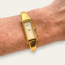 Load image into Gallery viewer, Vintage Gucci 1500L Gold Bangle Watch with Mother of Pearl Dial, 90s Quartz
