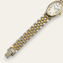Load image into Gallery viewer, Vintage Seiko Two-Tone Oval Quartz Watch Blued Hands Roman Numerals
